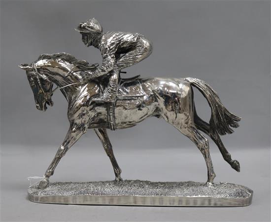A silver dipped horse and jockey